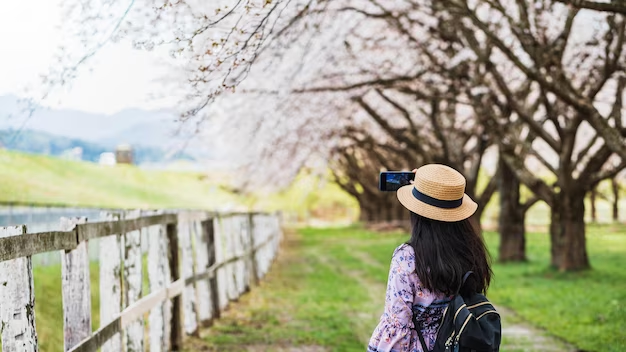 Tourist girl taking pictures of the area