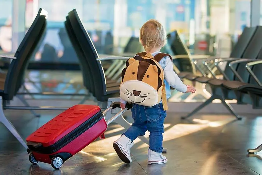 Kid With a Bag and Suitcase