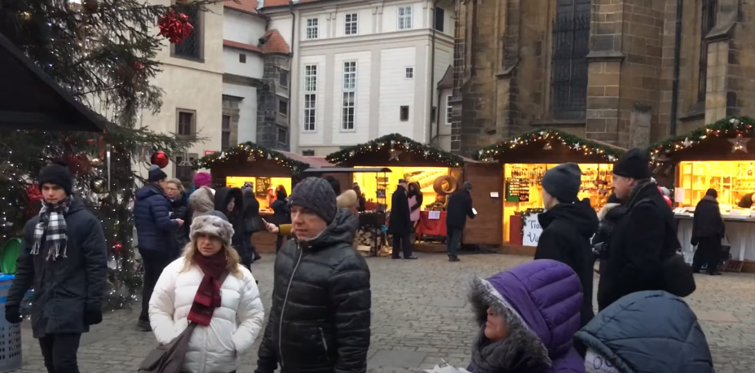 An image of a location with people outdoors and several booths