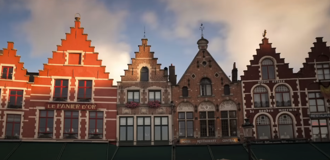 A lineup of buildings mostly in orange and brown tones