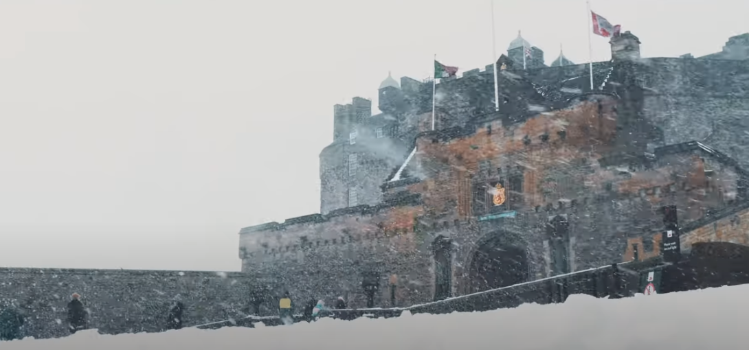 A castle-like structure faintly visible due to the presence of snow