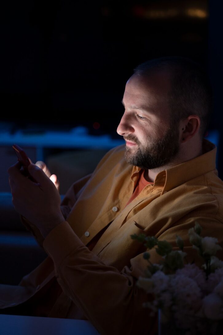 Man texting at night