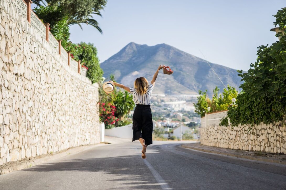 Happy woman on vacation jumping