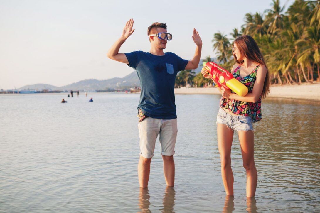 Couple playing on tropical beach