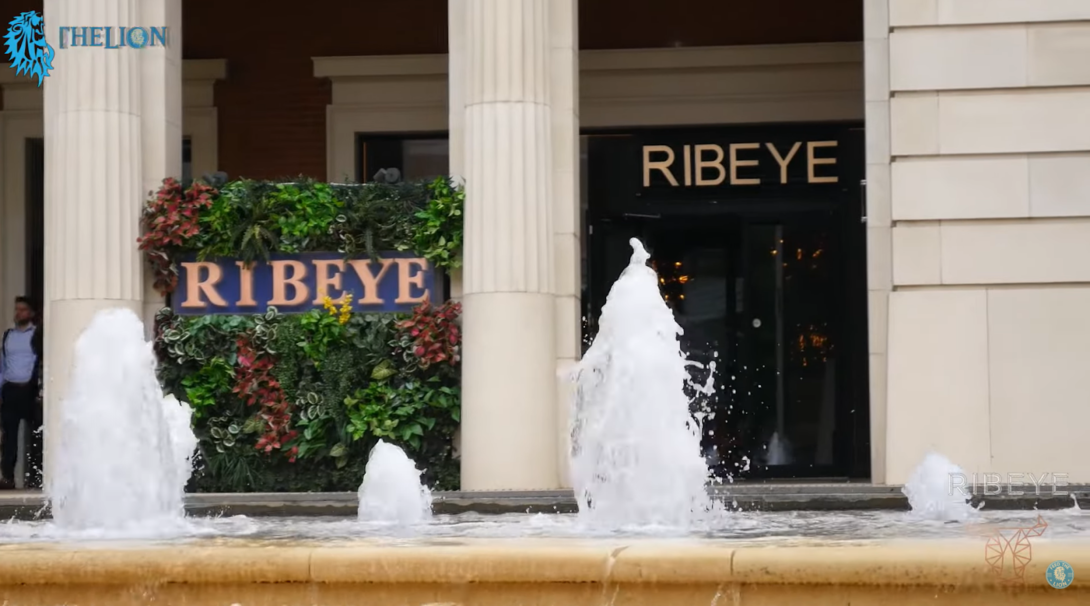 ribeye restaurant and fountains near the building