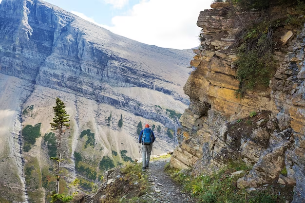 A man walking along a path against the background of nature